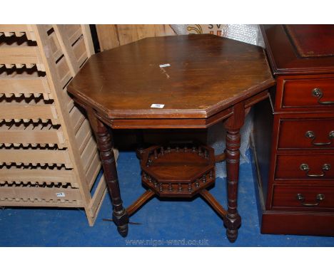 An octagonal occasional table with galleried under shelf.