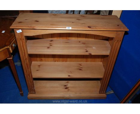 A modern pine three shelf bookcase, 36" high x 36" long x 12" deep.