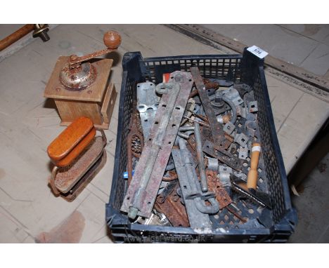 A tray of miscellaneous items to include gate bolts, coffee grinder etc.