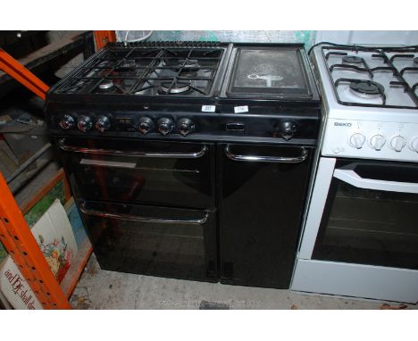 A four gas ring top Range cooker with electric hot plate and gas oven. 33 1/2" wide x 60" deep.