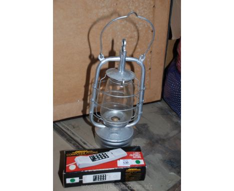 A paraffin lamp and push button telephone.