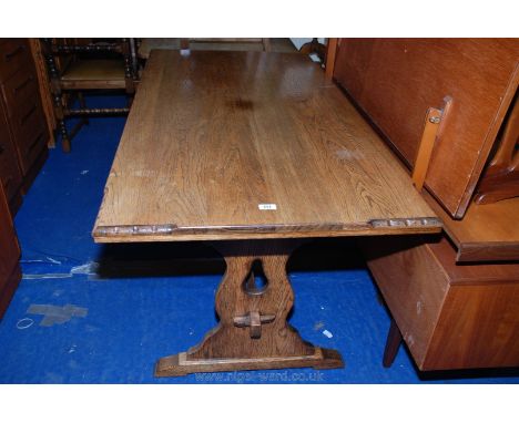 An oak top table (60'' long x 30" wide x 30" high) with four ladder back chairs and two matching carvers.