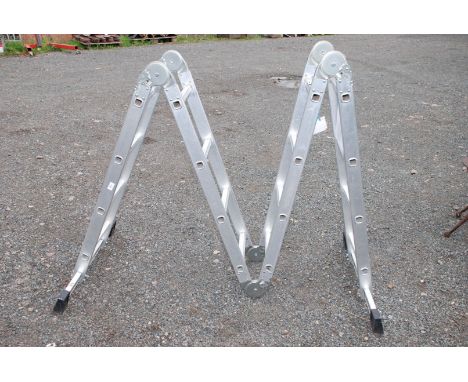 A 16 ring folding set of aluminium ladders.
