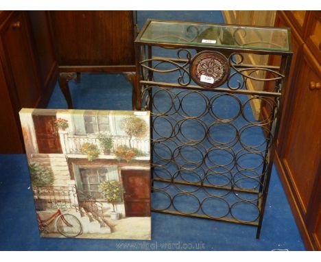 A 20 bottle, metal wine rack with glass shelf and canvas print picture.