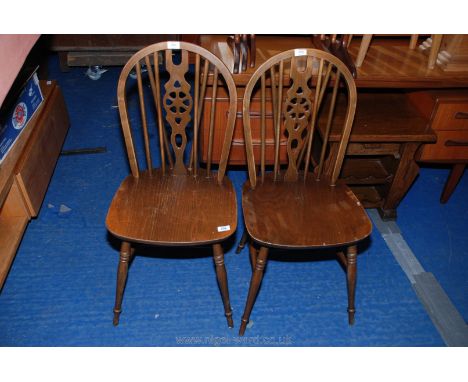 A pair of stick back with central splat chairs.