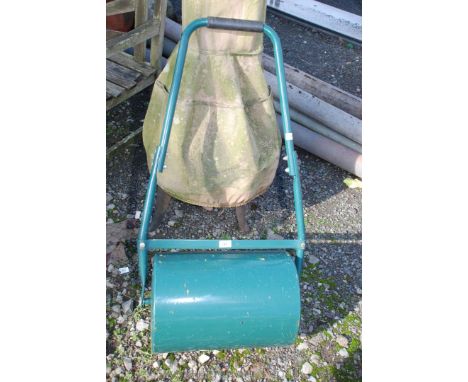 A metal water filled garden Roller, 17" wide x 12" diameter