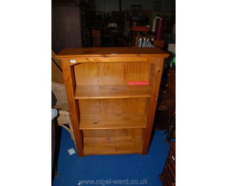 A modern pine three shelf open bookcase.