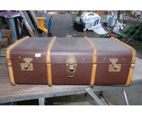 A Bent-wood bound travel trunk.