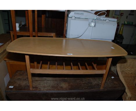 A coffee table with slatted under shelf.
