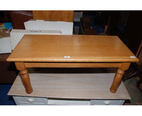 A solid light Oak coffee table, 39" x 17" x 17" high, makers stamp No.933 and signature to underside.