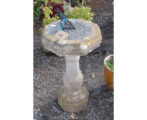 A sundial on a concrete plinth 27" high