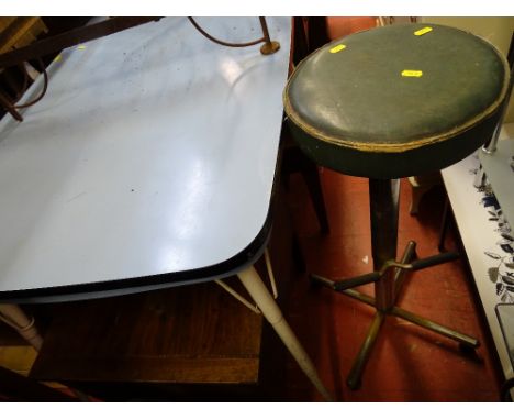 Metal legged table with blue Formica top and a vintage rise and fall bar stool