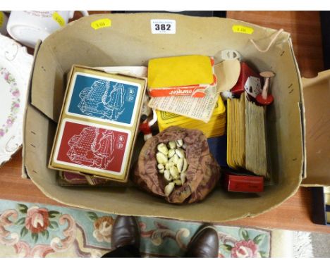 Box of vintage playing cards and a bag of marbles etc