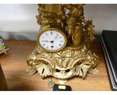 Gilt pendulum mantel clock with figural and scroll decoration etc