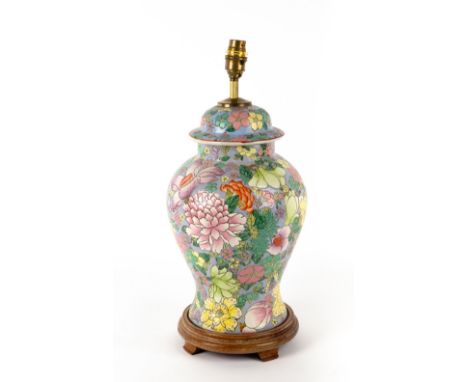 A BALUSTER PORCELAIN TABLE LAMP in the form of an Oriental vase and cover with turned wooden base, 20cm diameter x 46cm high 