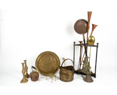 A GROUP OF METALWARE to include an old cast iron and brass plated corner stick stand, two copper coaching horns, brass stampe