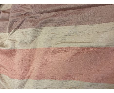 A PAIR OF ORANGE AND GOLD SILK AND LINED CURTAINS approximately 320cm wide at the bottom x 120cm wide at the top x 280cm in l