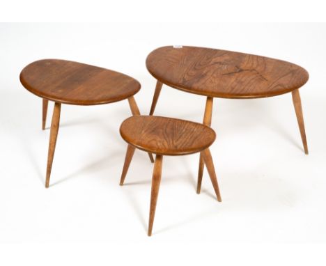 AN ERCOL LIGHT ELM NEST OF THREE OCCASIONAL TABLES with turned legs, the largest 64cm wide x 43cm deep x 40cm high Condition: