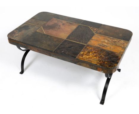 A TILE AND BRASS COFFEE TABLE with a wrought iron base, 100cm wide x 60cm deep x 44cm high Condition: in good condition, poss