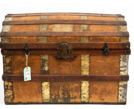 A LATE 19TH CENTURY AMERICAN DOME TOPPED TRUNK with leather handles and brass mounts, 84cm wide x 50cm deep x 58cm high Condi
