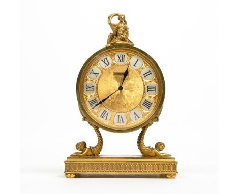 A LUXOR JARRARD FRENCH GILT METAL MANTLE CLOCK of circular form surmounted by a classical figurine, the silvered and gilt dia