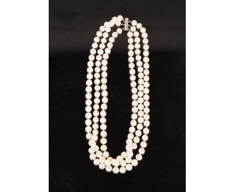 A TRIPLE STRING OF MODERN PEARLS each pearl 7cm diameter, overall weight 147 grams, having a modern chrome clasp Condition: i