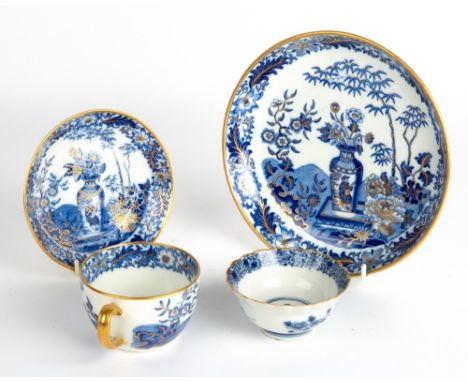 AN EARLY 19TH CENTURY WEDGWOOD PORCELAIN TEA CUP, SAUCER AND PLATE with blue, white and gilded floral vase and lute player de