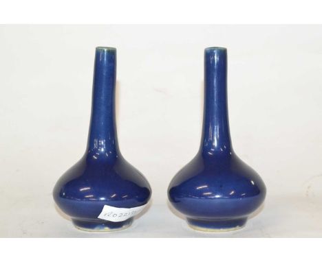 Pair of Chinese Blue Monochrome Ceramic Vases Qing Dynasty of slender bottle shape and dark blue glaze, 14cm high (2)14cm hig