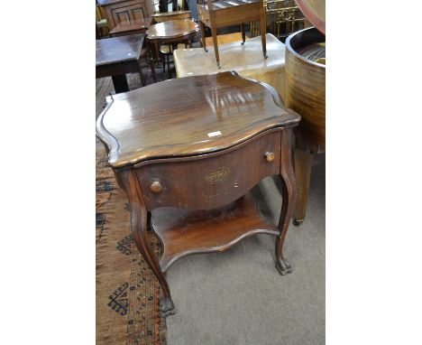 A Columbia Grafonola cabinet record player set in a mahogany cabinet with cabriole legs, a base shelf and carved feet, 71cm w