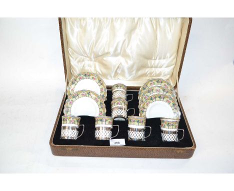 Aynsley set of six coffee cans and saucers pattern number B324/6, the coffee cans with pierced silver mounts set in fitted ca