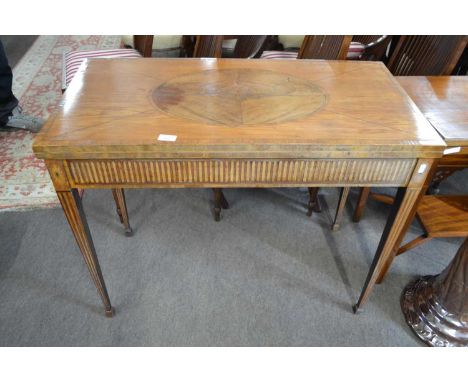 A Georgian Revival mahogany card table, the hinged rectangular top decorated with a geometric design and central oval panel, 
