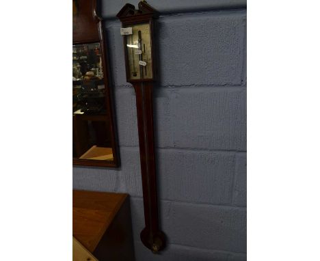 A Georgian mahogany stick barometer of typical form, lacking cover, 97cm high