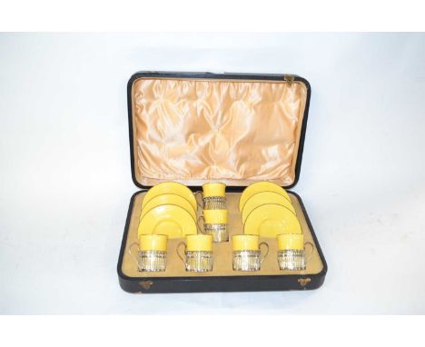A Wedgwood cased set of six coffee cans and saucers pattern number 25362, the coffee cans with pierced silver frames and hand
