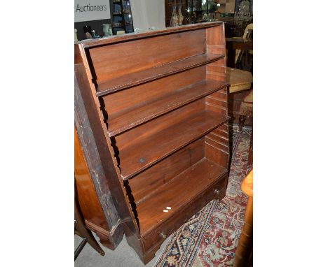 A small late 19th Century mahogany adjustable book case of tapering form with base shelf and bracket feet, 73cm wide