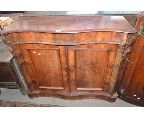 A Victorian mahogany chiffonier base with serpentine front and two panelled doors raised on a plinth base, 114cm wide