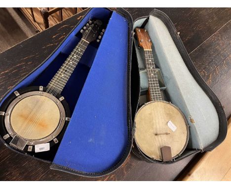 An eight string banjo bearing lable for John Grey &amp; Sons, London together with a further four string example (2)