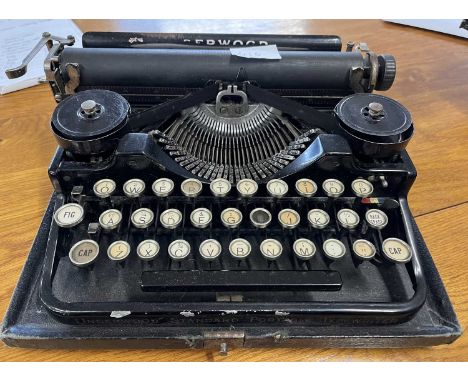 A vintage Underwood Standard Portable typewriter with case