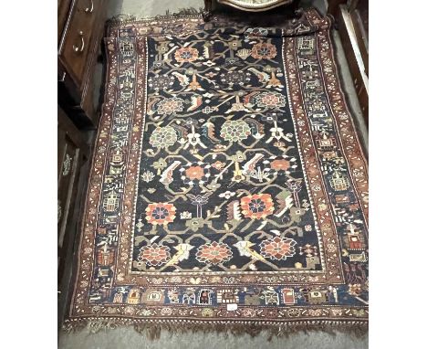 A 19th Century Persian rug possibly Sultanabad with large central floral panel surrounded by a three tier border, 183 x 130cm
