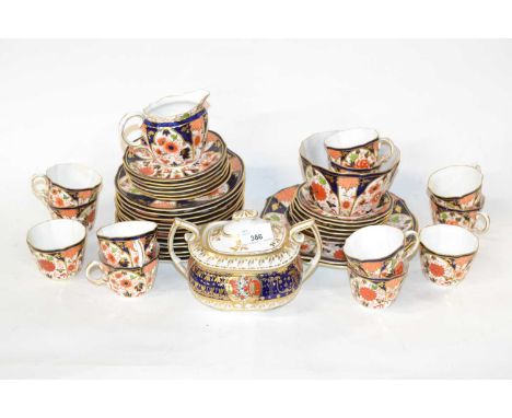 A quantity of Royal Crown Derby tea wares with Imari designs comprising sucrier and cover, milk jug, twelve cups, saucers and