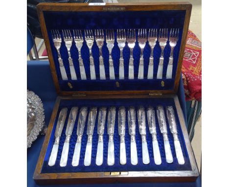 Late Victorian silver plated fish service for 12 people, with mother-of-pearl handles and silver collars, in fitted velvet-li