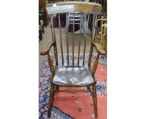 An elm-seated kitchen stick-back elbow chair 