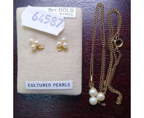 A 9ct gold and cultured pearl pendant on a 9ct gold chain, and a pair of matching earrings 