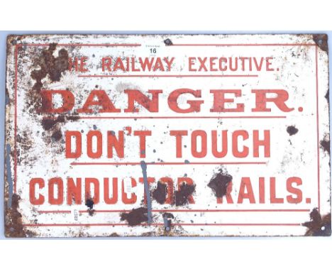 A Vintage enamelled railway sign "Danger don't touch conductor rails", length 50cm 