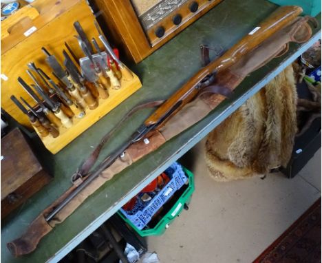 A Chinese air rifle with Vintage carrying case 