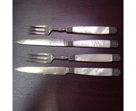 A set of 4 silver and mother-of-pearl fruit knives and forks 