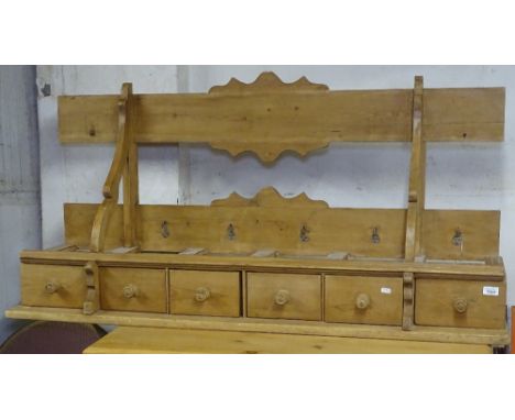 A Continental polished pine hanging spice rack, with 6 drawers, L142cm 