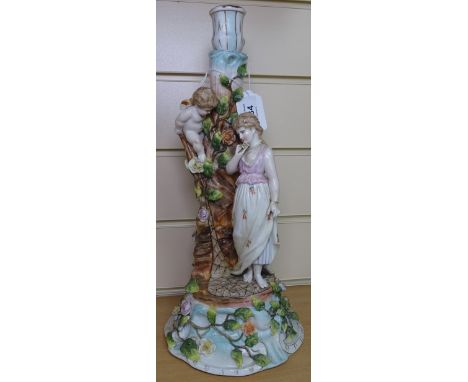 A Continental porcelain lamp base, surmounted by Classical figures, height 36cm 