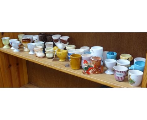 A shelf of Vintage egg cups 