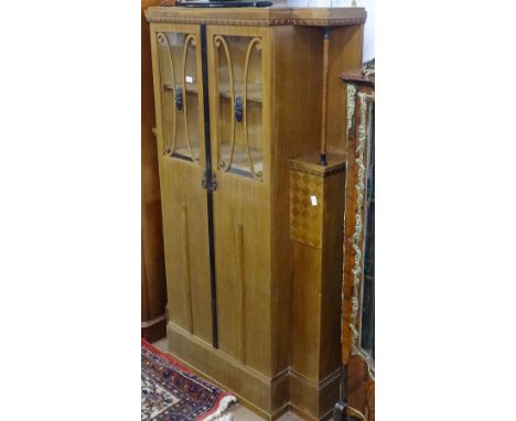 A Continental Art Deco walnut break-front cabinet, with 2 glazed panel doors, W110cm, H174cm 