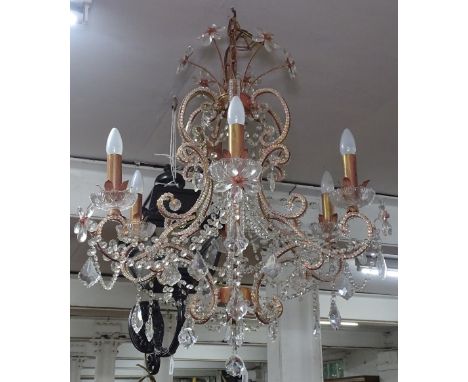 A scrolled metal and glass lustre 6-branch chandelier 